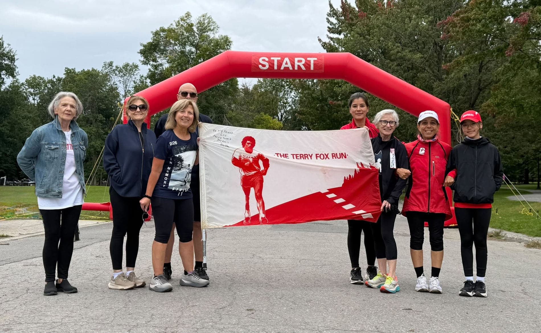 Boreal club members holding a Terry Fox Run banner.
